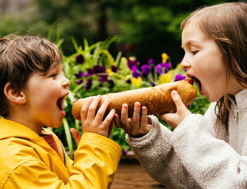 kids eating a hot dog at logger's grill capilano suspension bridge park