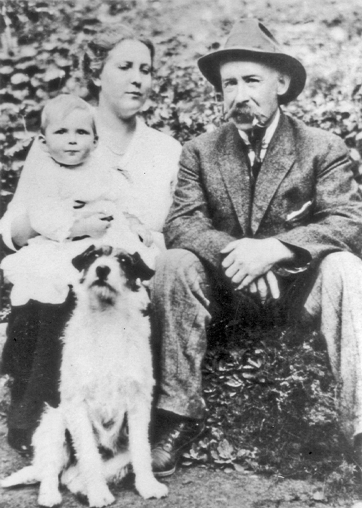 A historical black and white photo featuring Edward Mahon, the third owner of Capilano Suspension Bridge, with his family, providing insight into the bridge's ownership history and the family's connection to the iconic landmark