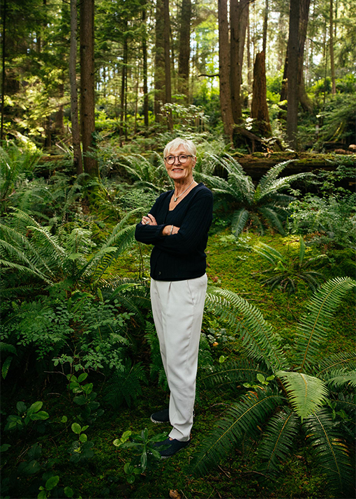 Owner and CEO of Capilano Suspension Bridge Park stands confidently, symbolizing leadership and stewardship of the iconic natural attraction