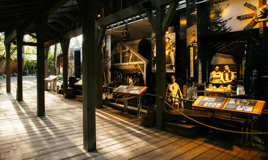 The Story Centre bathed in sunlight on a peaceful morning at Capilano Suspension Bridge Park, inviting visitors to explore the rich history and cultural significance of this iconic landmark