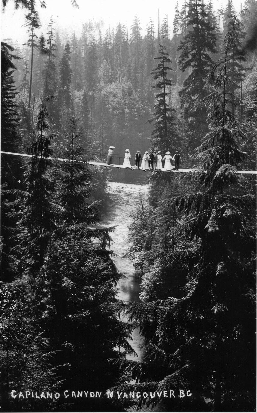 A historical black and white photo captures a wedding party on the first Capilano Suspension Bridge in 1889, offering a glimpse into the bridge's early days and its significance as a landmark for celebrations and gatherings