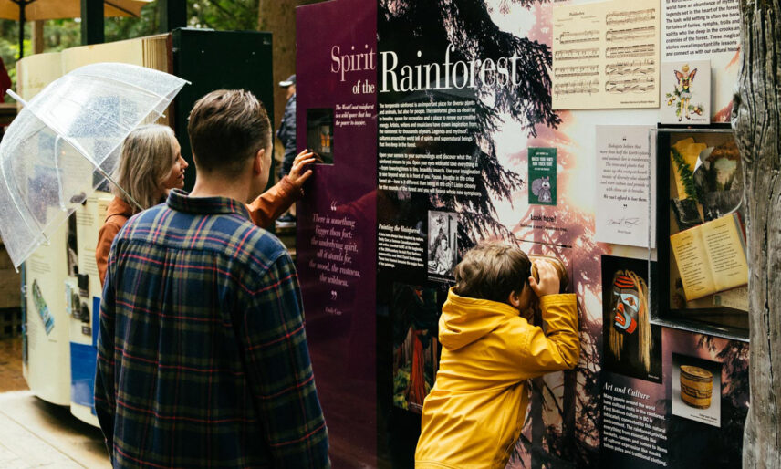 family reading the living forest exhibit panels capilano suspension bridge park